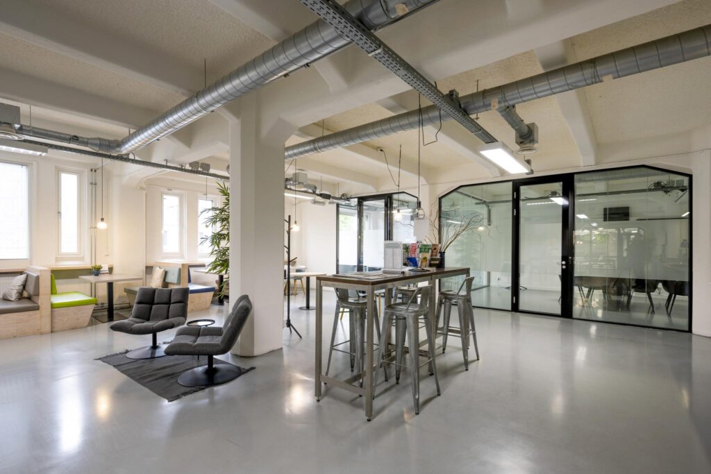 Modern coworking space on Van Diemenstraat with industrial design elements and collaborative seating areas.